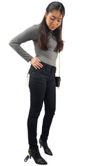 Woman in black skinny jeans