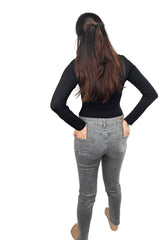 Woman in grey skinny jeans